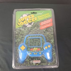Super Soccer Hand-held Electronic Game.